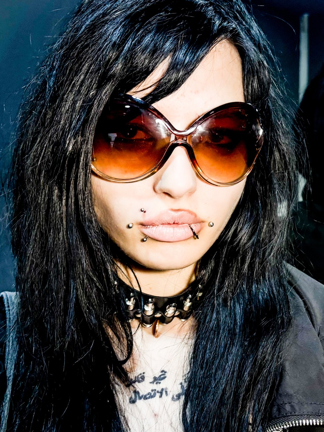 madonna piercing with lip studs, sunglasses